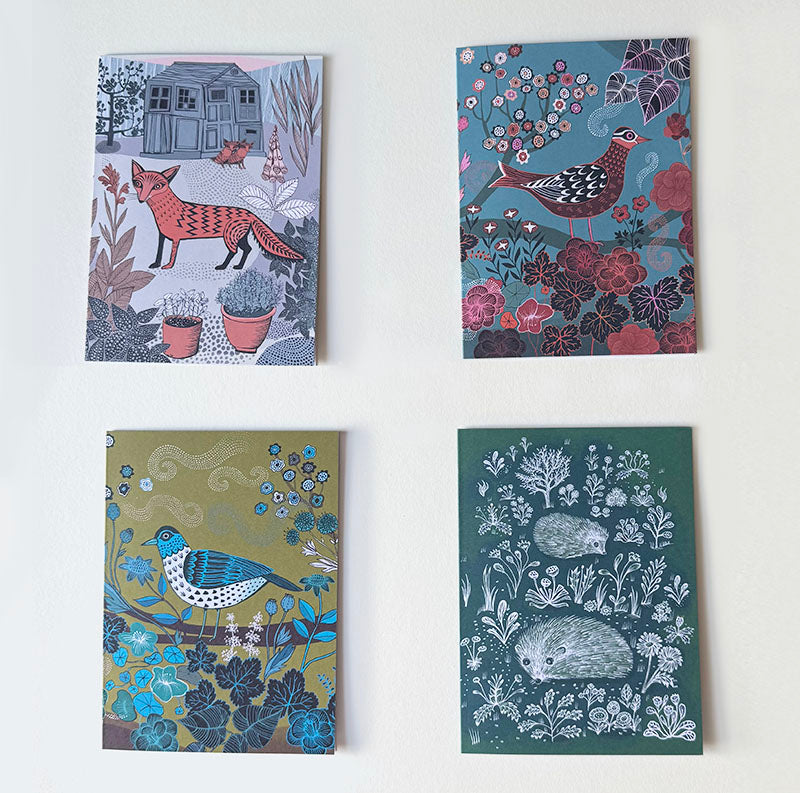 Set of 4 cards, Nature's Ways Four decorative greetings cards with animal and nature-themed designs.
