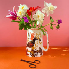 bird-print jug of flowers
