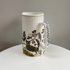 decorated jug with cat print
