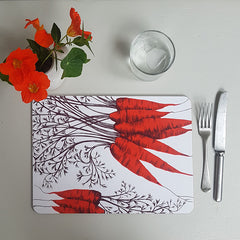 Lush Designs carrot table mat with glass of water, knife, fork and glass of water plus little jug with orange nasturtiums