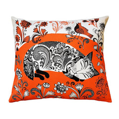 cushion printed with sleeping black and white kitten on orange floral background
