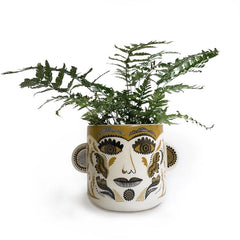 Lush designs plant pot printed with patterned clown face in olive and black on cream and featuring 3D ears on either side 