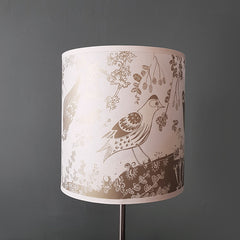 Lush Designs siskin lampshade in gold on a lamp