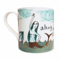 Lush Designs bone china mug with print of tattooed mermaid in turquoise and black decorated with gold lustre