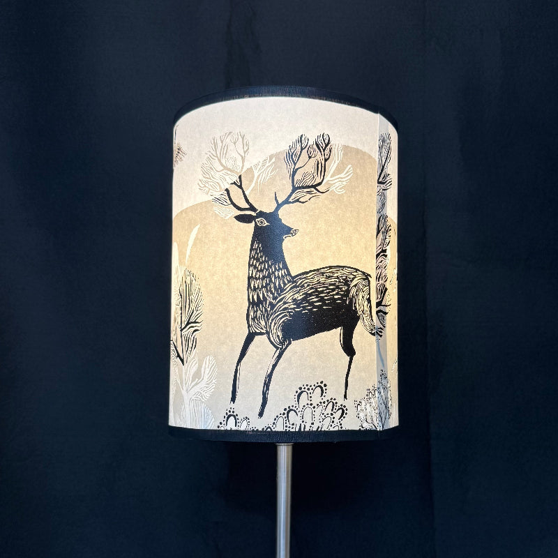 Lampshade with deer design on a dark background