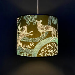 Lampshade in dark green with ocelot print and foliage in turquoise