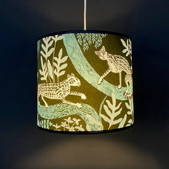 Lampshade in dark green with ocelot print and foliage in turquoise