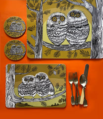 Lush Designs owl mats and coasters on an orange background