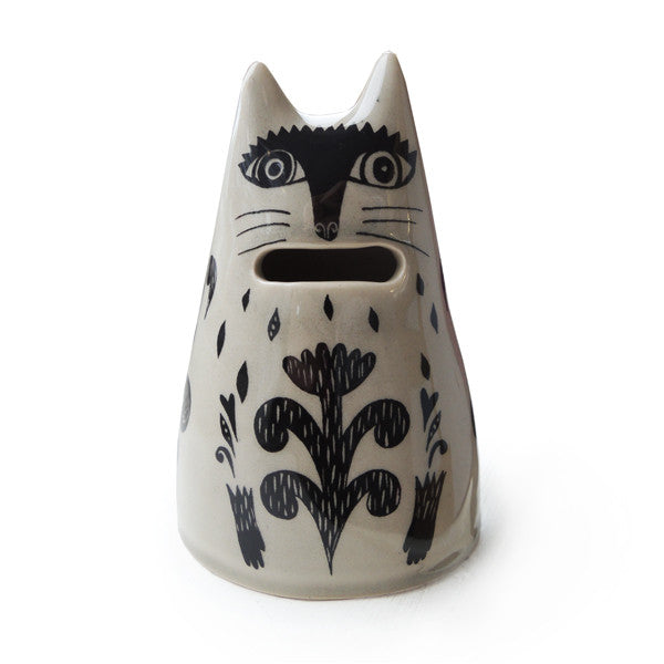 Lush designs cream and black cat-shaped ceramic money bank