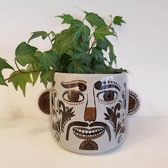 Lush Designs plant pot with a tattooed face with a droopy moustache containing an ivy plant