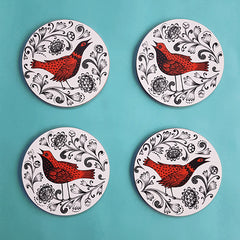 4 coasters with orange and black bird print