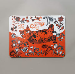 table mat depicting orange cat with fancy patterns  rolling in flowers