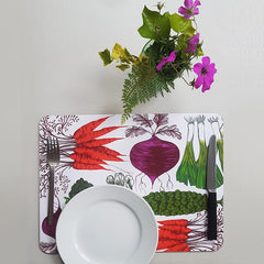 Vegetable print table mat with plate, knife and fork and a posy of flowers