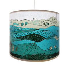 Lush Designs lampshade printed lampshade with design of landscape in shades of green and turquoise.
