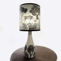 Lush designs ceramic lamp base with lampshade printed with wild boars and little trees in very dark brown