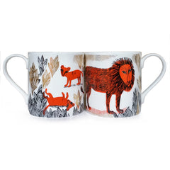 Bone china mug with orange and black print and gold lustre detail