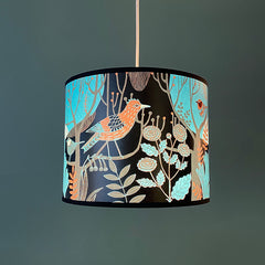 bird and flower print lampshade in strong turquoise and black