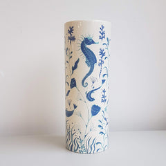 Lush Designs Cylindrical ceramic vase with seahorses, fish and jellyfish printed in shades of blue