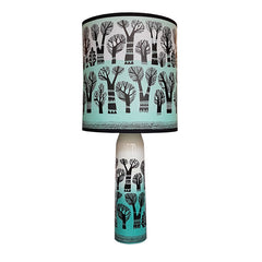Lush Designs lamp in teal, black and white featuring tree print on shade and base