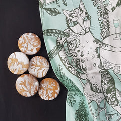 Lush Designs cat tea towel with some fancy biscuits