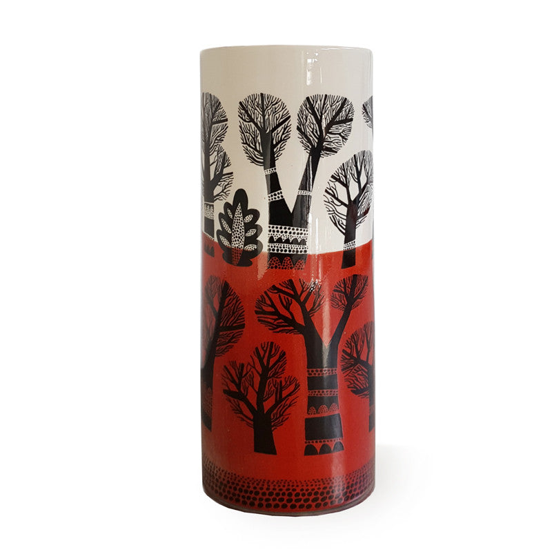 Cylindrical earthenware vase with landscape of winter trees, dipped red glaze