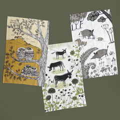 Three animal-themed tea towels