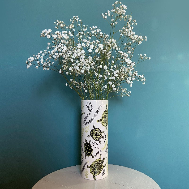 Vase with print of turtles filled with gypsophila