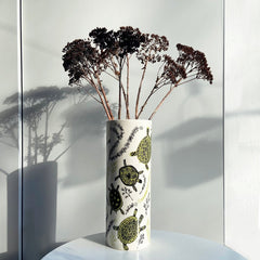 Terrapin print vase with dried plants in