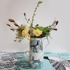 Lush designs mugs used as a vase with daffodils and twigs